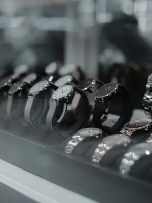 A detailed view of luxury wristwatches displayed in a store showcase, highlighting style and sophistication.