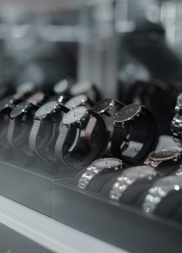 A detailed view of luxury wristwatches displayed in a store showcase, highlighting style and sophistication.
