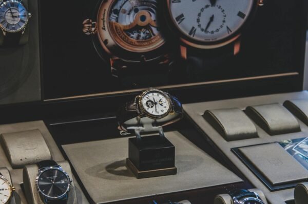 Elegant luxury wristwatches displayed in a sophisticated store with a focus on craftsmanship.