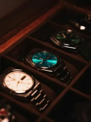 Showcase of elegant luxury watches in a display case with warm lighting.
